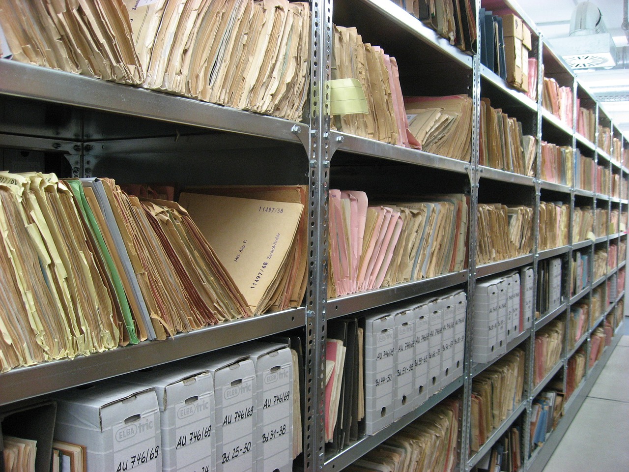 Lawyer's office: Shelves stacked with filed documents and case boxes