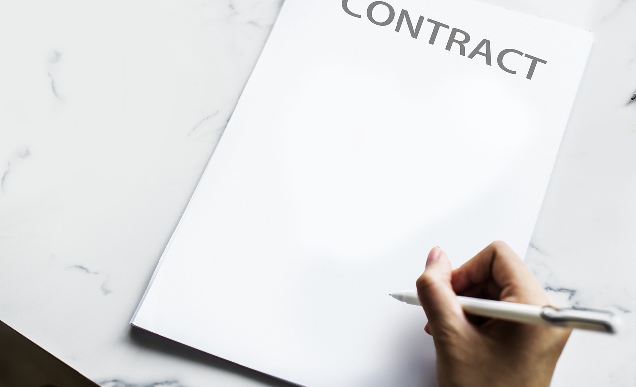 Pen in hand, reviewing insurance contract details