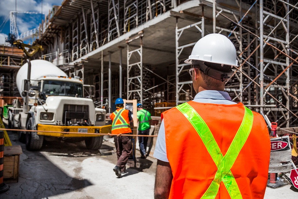 Construction site: engineers and consultants working together.