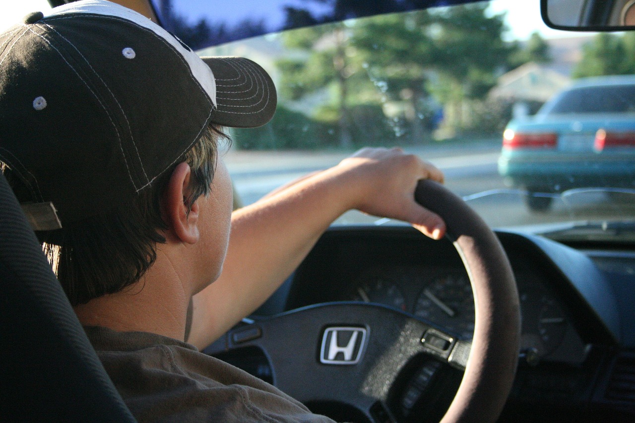 Man behind wheel navigating through traffic 