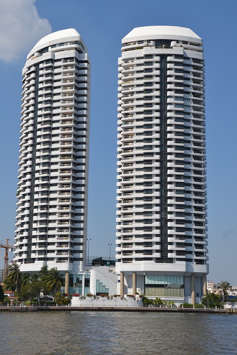 Twin tower condominium complex with modern architecture and upscale residences.