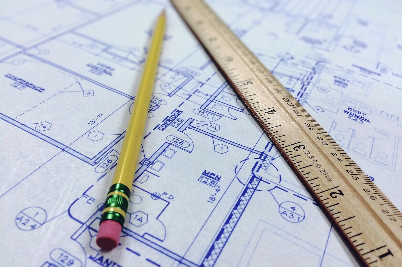 Pencil and ruler on architectural plan