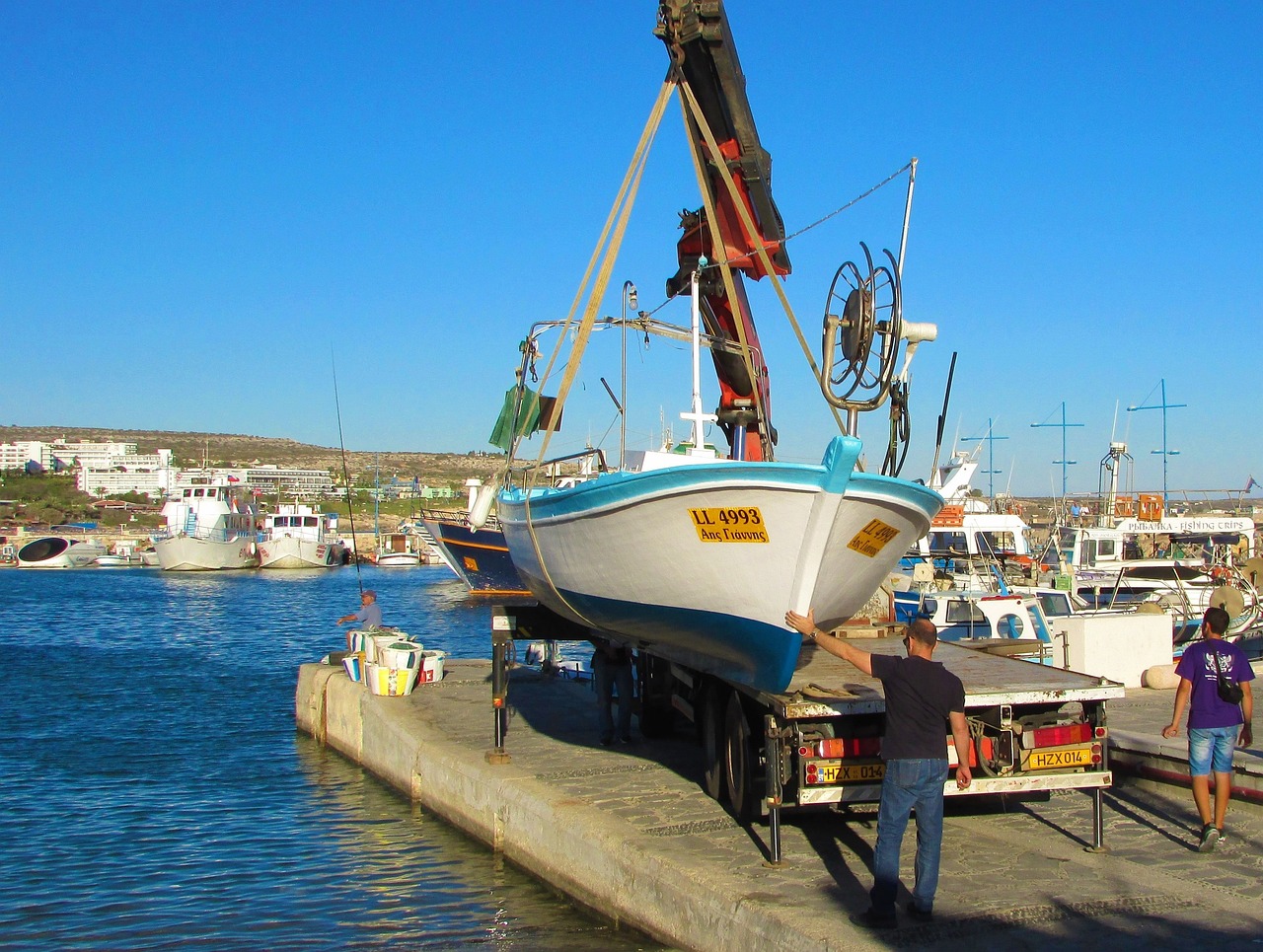 Loading boat on flatbed trailer