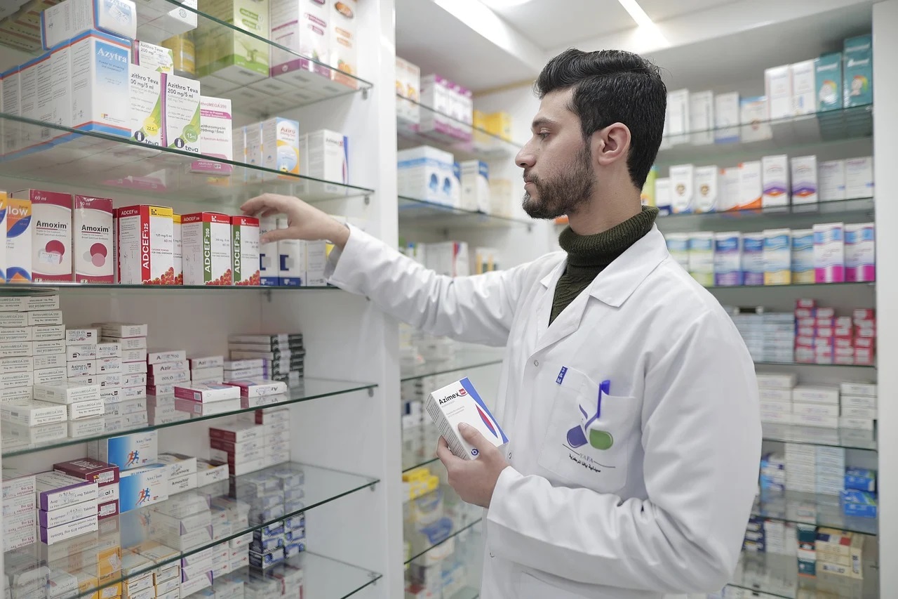 Pharmacist filling patient's prescription.