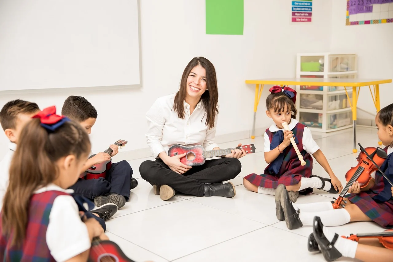 Montessori teacher guides young students in a music lesson