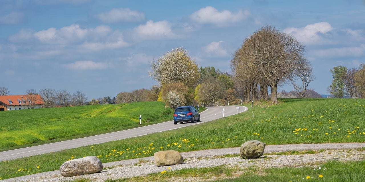 A car navigates a steep, winding road