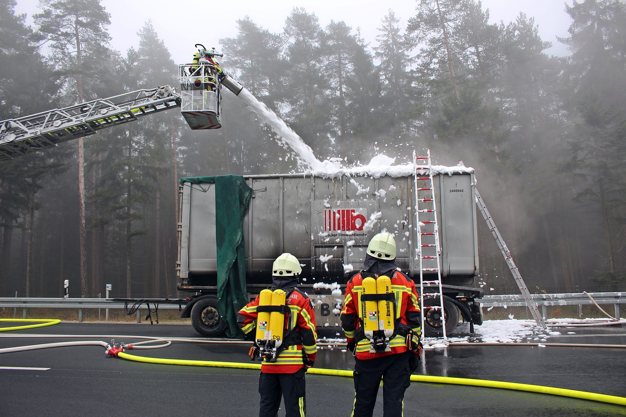 Firefighters putting out a fire on a container