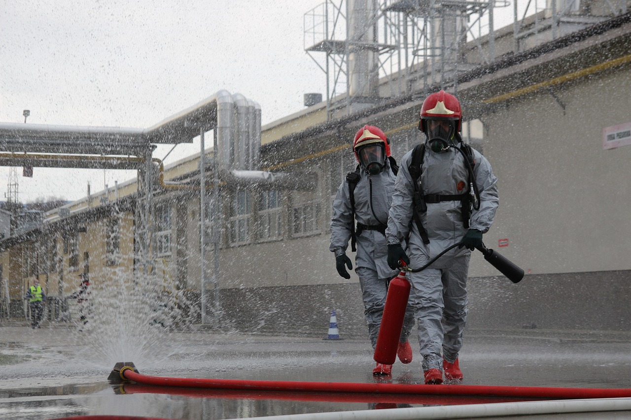 Hazmat team responds to chemical storage leak.