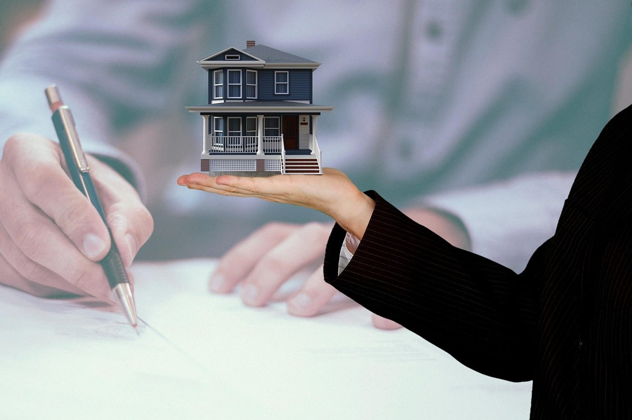 Broker and client finalizing a home sale