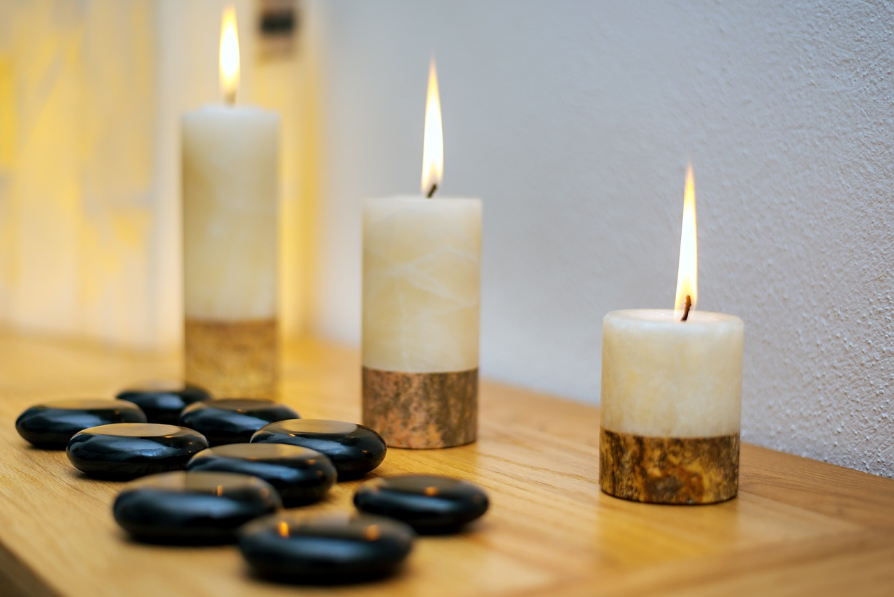 Lit Candles and Zen Stones at a Wellness Center