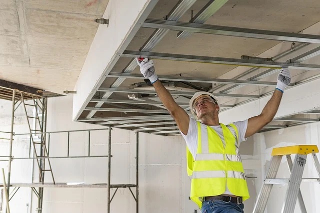Drywall installation in progress at a construction site