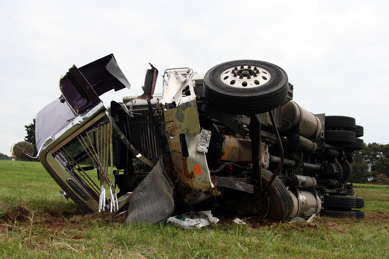 Dump truck wreckage on road