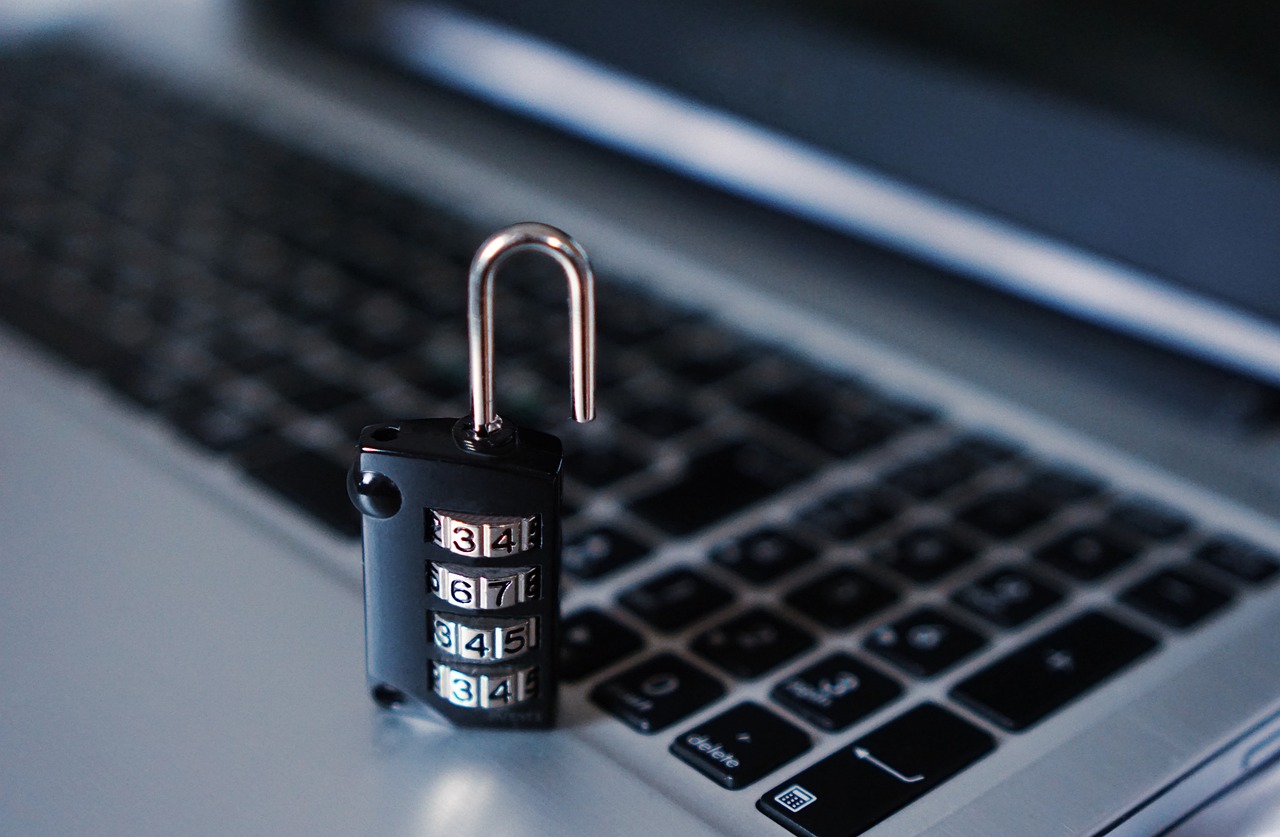 An open lock on a keyboard, symbolizing compromised security and vulnerability to cyber attacks