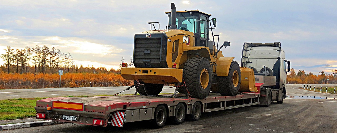 Bulldozer on the Move: Securely Loaded on Flatbed Semi