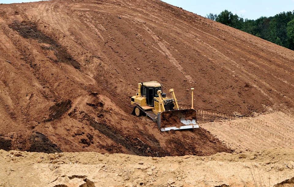 Earth  moving maching leveling and grading land for construction