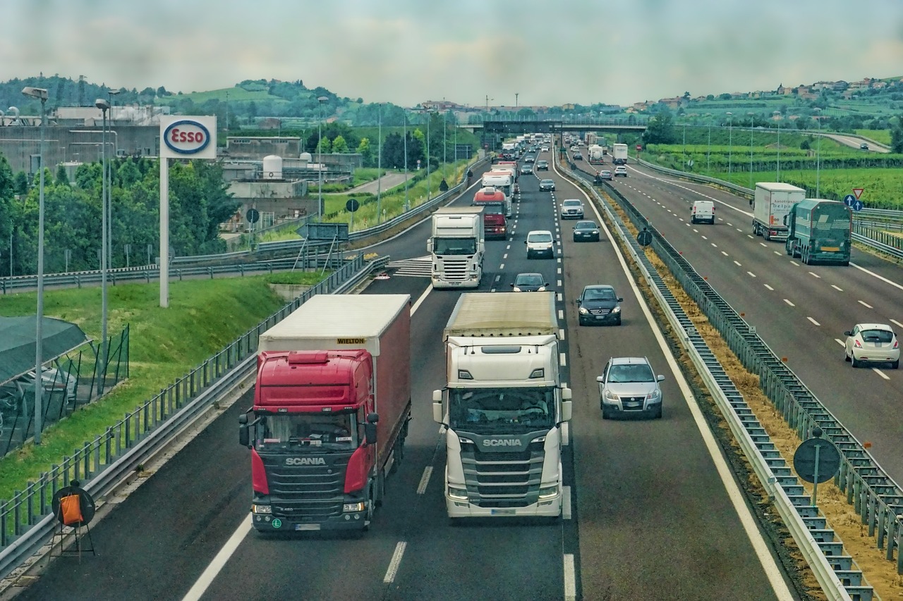 Highway traffic: commercial and private vehicles share the road.