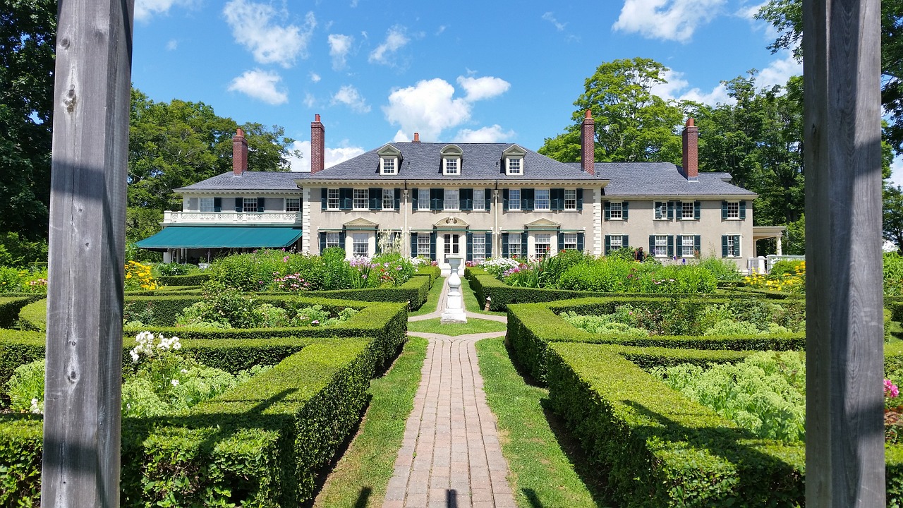High-end estate with manicured lawn and gardens