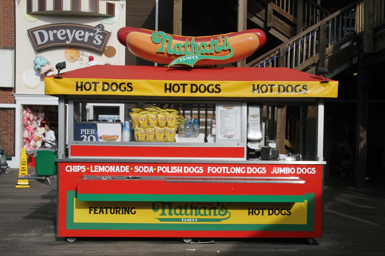 olorful hotdog stand on a bustling city street.