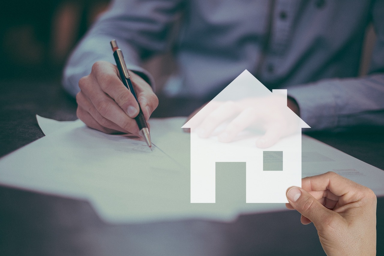Homebuyer signs mortgage contract with lender.