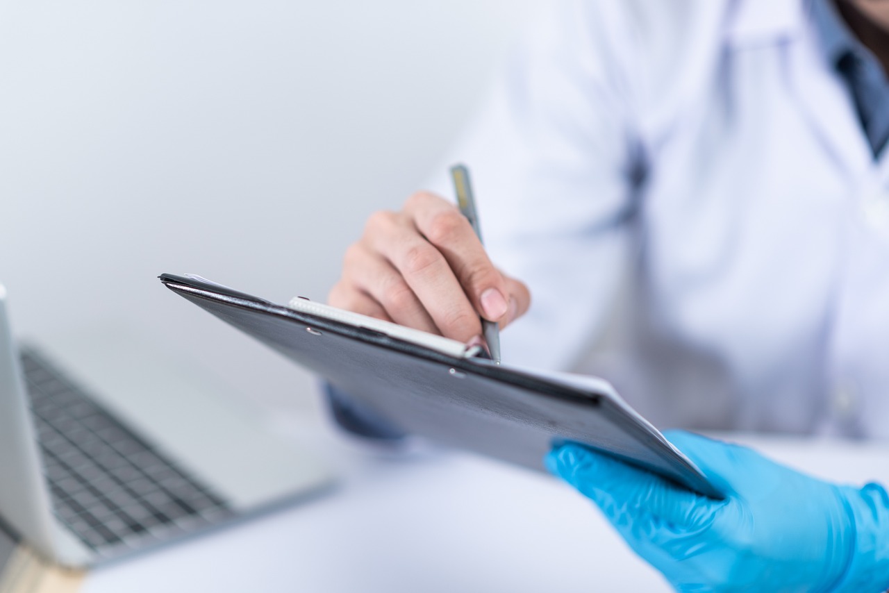 Healthcare professional updating a patient's medical chart