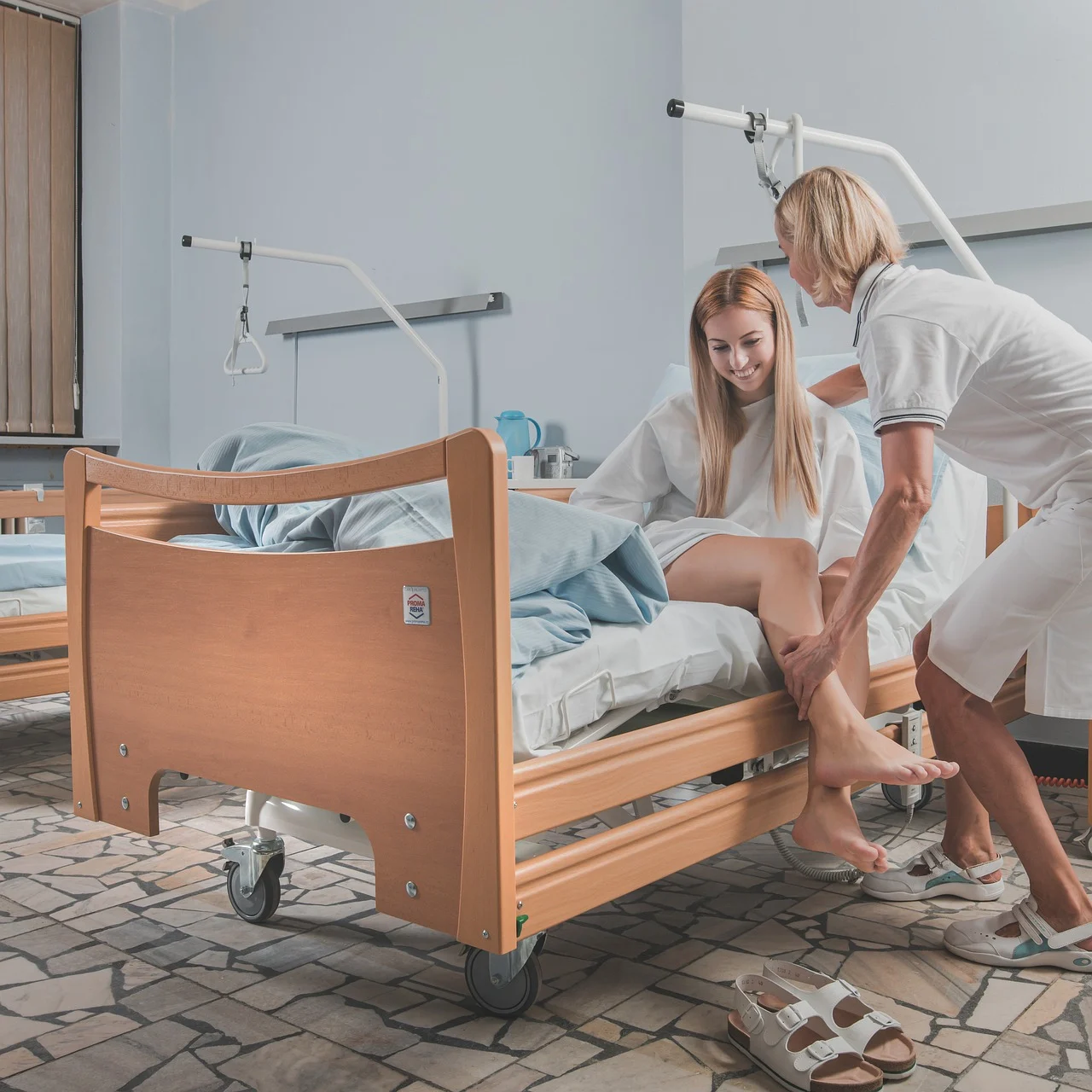 Nurse providing supportive care, assisting patient with mobility