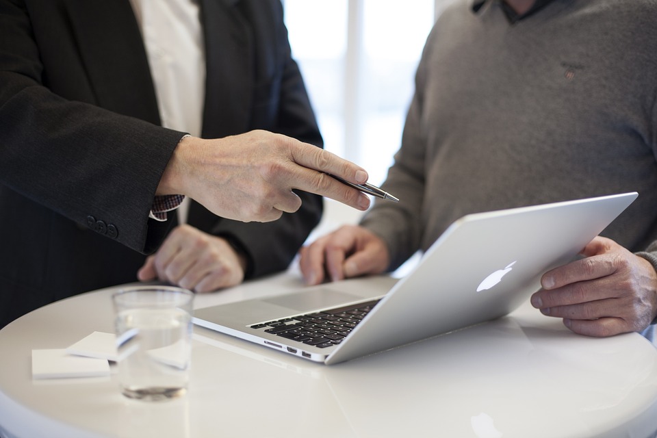 Financial advisor discusses investment strategies with client.
