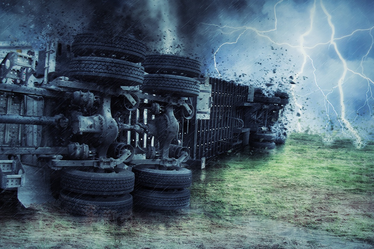  Semi-truck overturned on a rain-soaked highway.