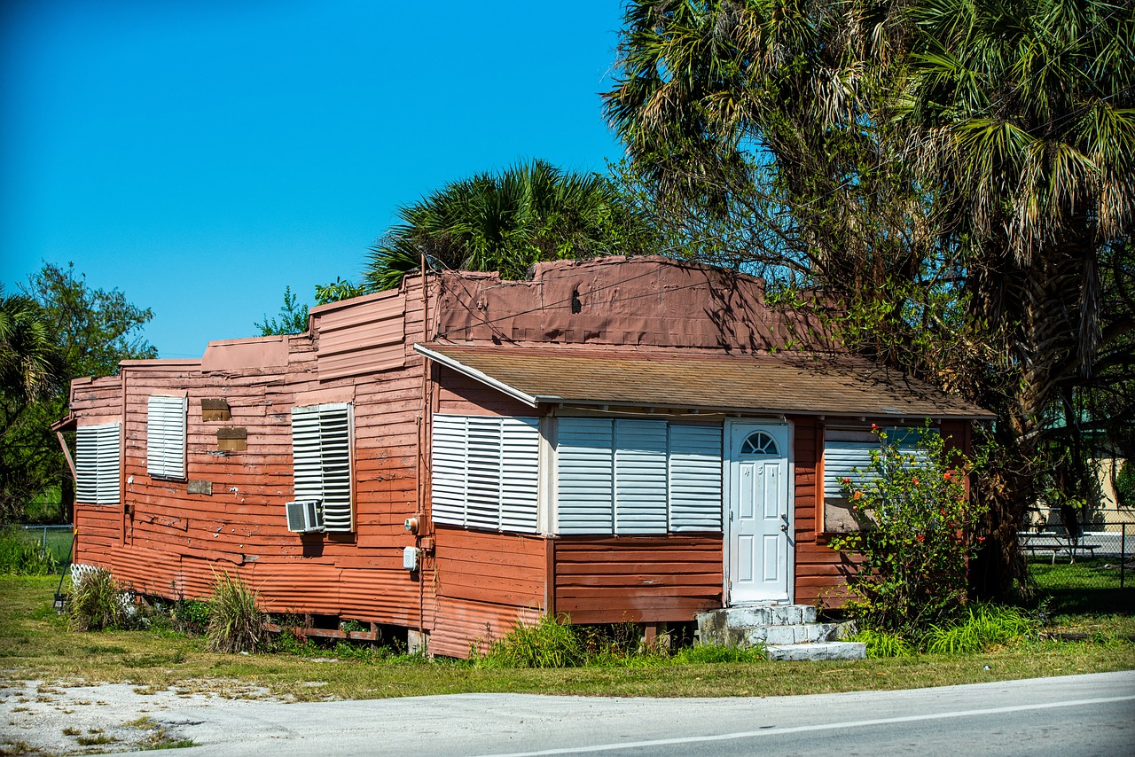Weathered, older home with a worn façade.