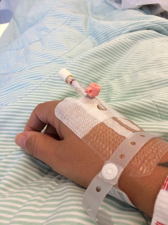 Injured karate student receives medical attention for serious arm injury.