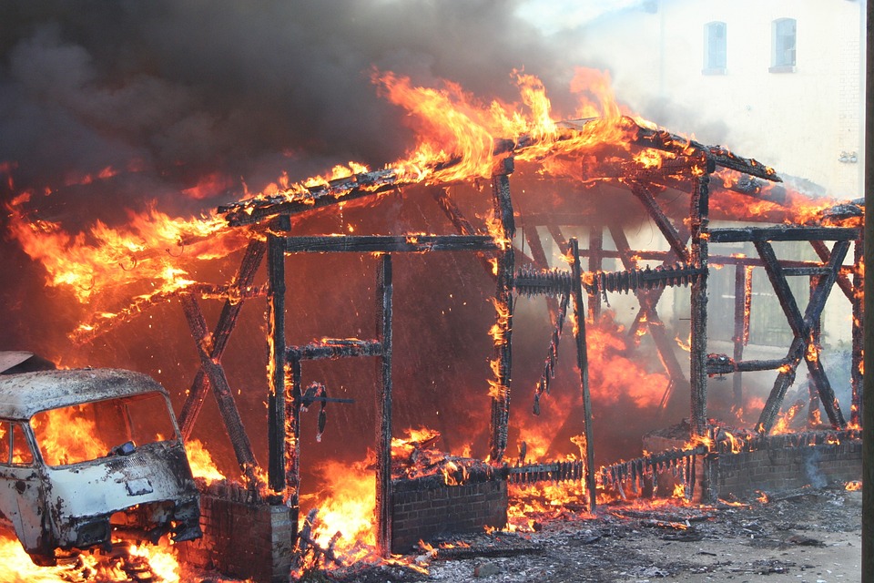 Intense flames engulf a foundry.