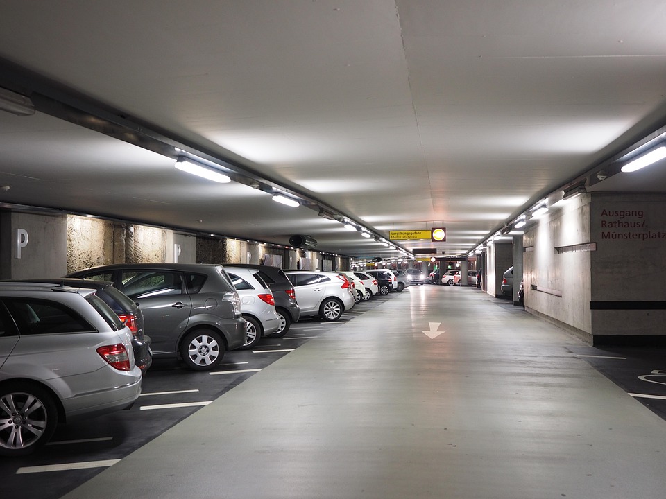 Multi-level car park with vehicles parked.