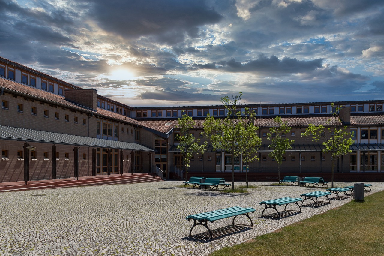 Serene cobblestone seating area outside a private school