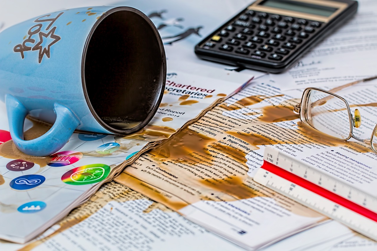 Coffee spill on office desk, illustrating a common workplace accident