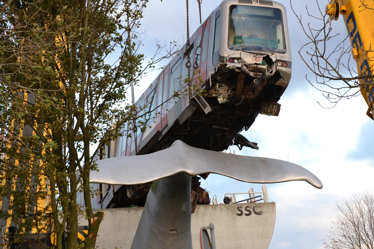 Train bogie hangs from bridge after catastrophic derailment