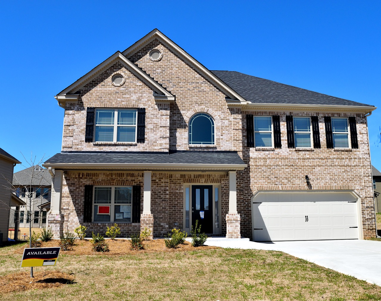 Residential home for sale. "Available sign" in front yard
