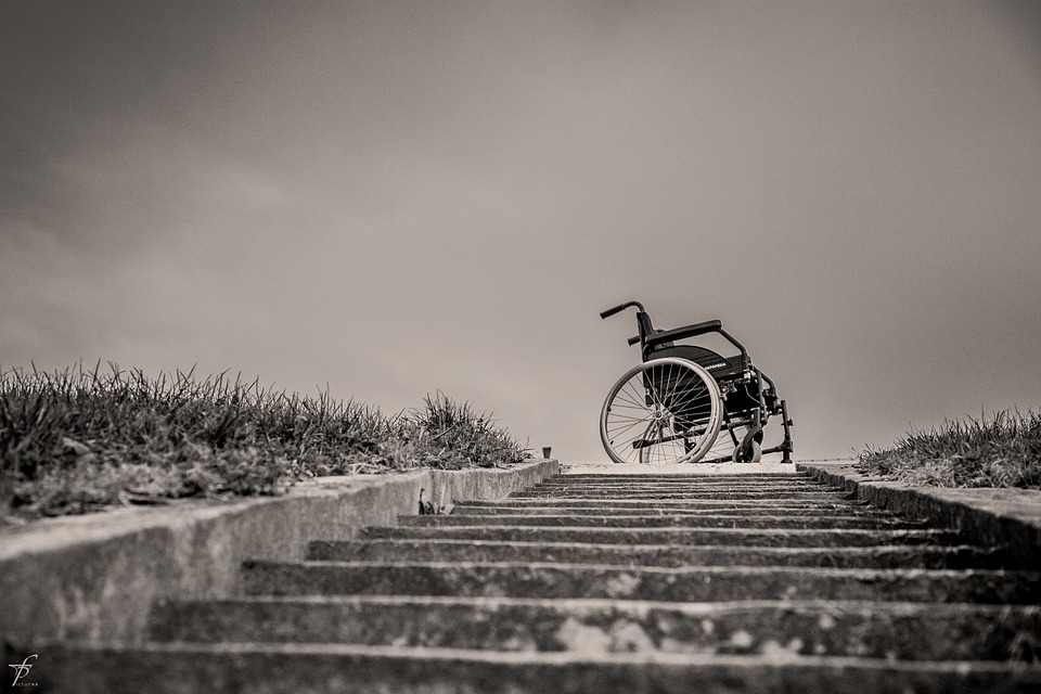 Wheelchair at top of stairs